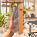 A hand holding the Flying Pawfect Long Tooth Comb, labelled 8 inches long with 1.5 inch pins